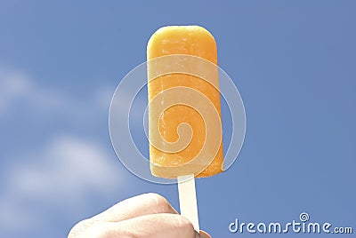 Frozen orange Popsicle Stock Photo