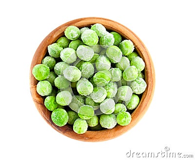 Frozen peas in wooden bowl Stock Photo