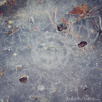 Frozen puddle texture. Toned photo. Cold winter. Stock Photo