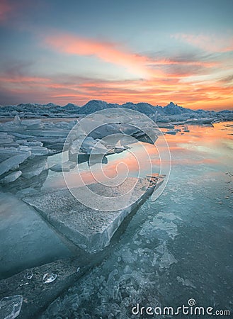 Frozen sea during sunset Stock Photo