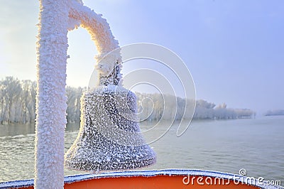 Frozen ship bell in winter time Stock Photo