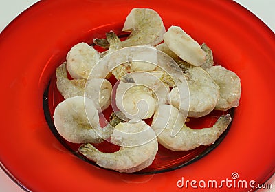 Frozen shrimp thawing on plate Stock Photo