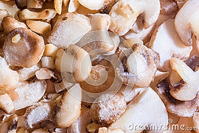 Frozen sliced mushrooms, champignons on the table. Vegetarian food Stock Photo