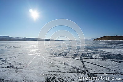 frozen blue Baikal lake in sunny blue sky in winter season Stock Photo