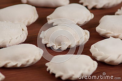 Frozen vareniki dumplings, pie before boiling - traditional Uk Stock Photo