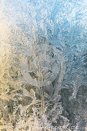 Frozen winter window with shiny ice frost pattern texture. Christmas wonder symbol, abstract background. Extreme north Stock Photo