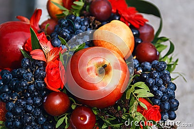 Fruit basket with apples, grapes and cherries Stock Photo