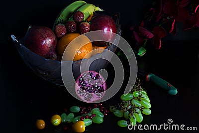 Fruit basket with flower and knife Stock Photo