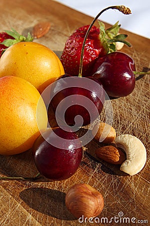 Fruit and berries on a cutting board proper food preparation home cooking foodphoto Stock Photo