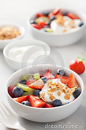 Fruit berry salad with yogurt and granola for healthy breakfast Stock Photo