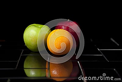 Fruit on black tile Stock Photo