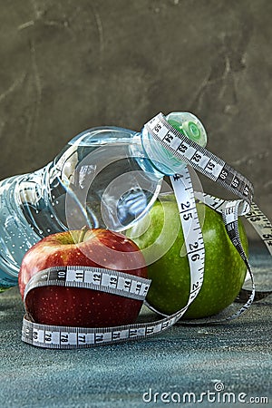 Fruit, a bottle of water, a meter on a blue with a divorce background Stock Photo