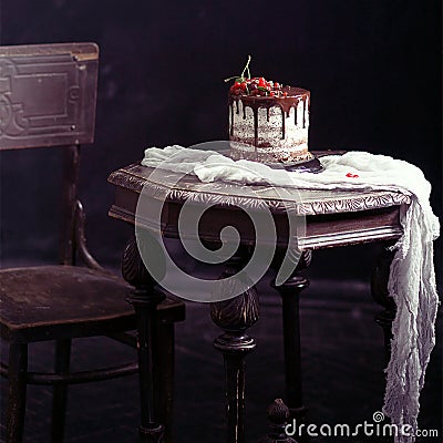 Fruit cake on the table in rustic kitchen; selective focus; vint Stock Photo