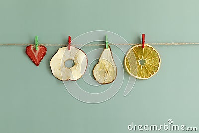 Fruit chips are dried on a rope Stock Photo