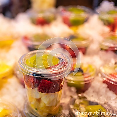 Fruit counted in individual containers ready for consumption and preserved with ice, Mercado de San Miguel, Madrid. Stock Photo