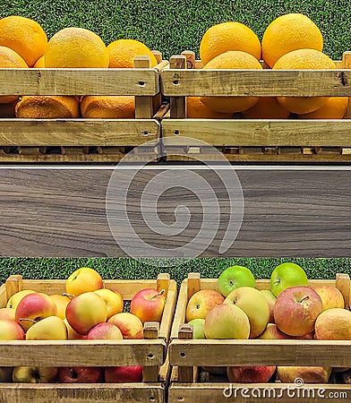 Fruit crates with oranges and apples Stock Photo