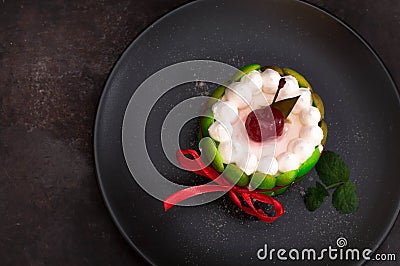 Fruit dessert tart with whipped sweet curd cream and with sweet cherry on top. Old black background. Close-up. Top view Stock Photo