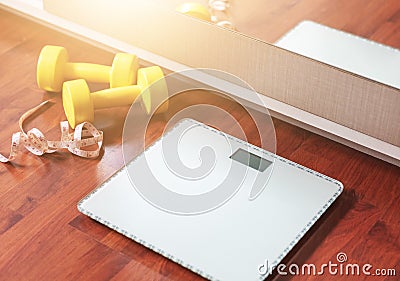 Fruit, dumbbell and scale, fat burn and weight loss concept Stock Photo