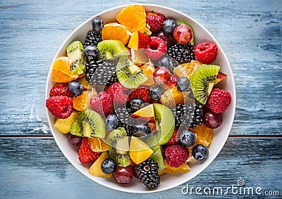 Fruit fresh mixed tropical fruit salad. Bowl of healthy fresh fruit salad - died and fitness concept Stock Photo