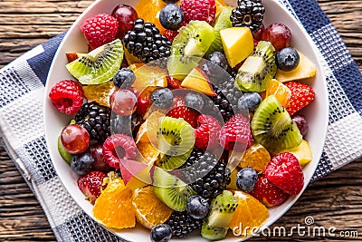 Fruit fresh mixed tropical fruit salad. Bowl of healthy fresh fruit salad - died and fitness concept Stock Photo