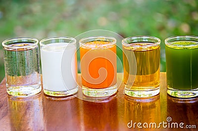 Fruit juices, orange juice, apple juice, kiwifruit juice,with milk and water in glass Stock Photo