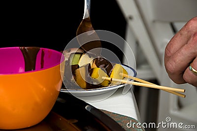 Fruit kabobs with chocolate sauce Stock Photo