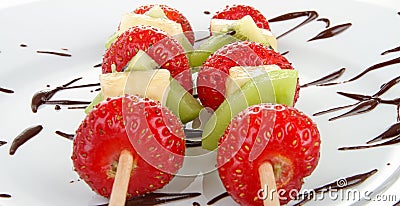 Fruit kebabs and chocolate Stock Photo