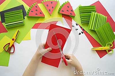 Fruit made of craft paper. Children`s hands Stock Photo