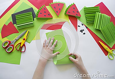 Fruit made of craft paper. Children`s hands Stock Photo