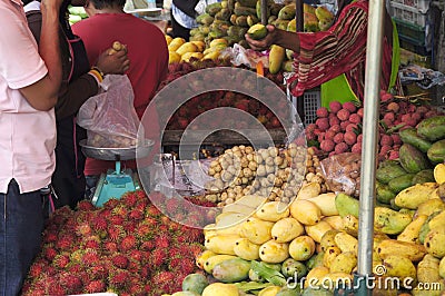 Fruit market in Malaysia. Hawkers sell various types of local fruit at a reasonable price. Editorial Stock Photo