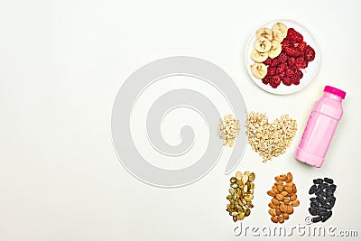 Fruit milkshake with oatmeal, raisins, apricot and pumpkin seeds Stock Photo