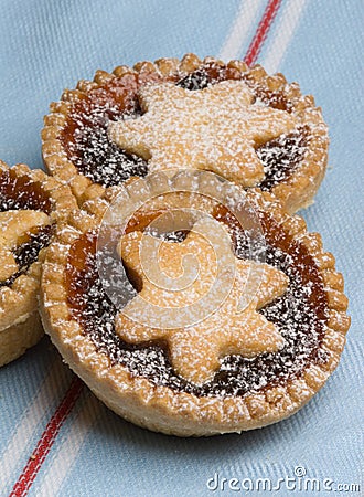 Fruit mince tarts for christmas day on tea towel Stock Photo