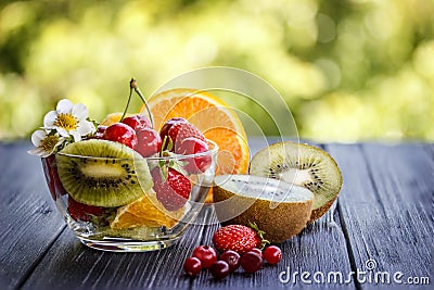 Fruit mix strawberry cherry kiwi orange cranberry Stock Photo