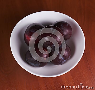 Fruit plum in plate Stock Photo