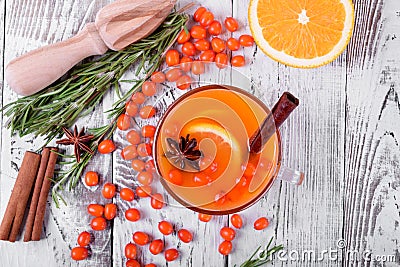 Fruit punch with sea buckthorn berries, citrus and spices in a glass cup Stock Photo