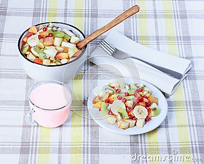 Fruit salad in a ceramic bowl, yogurt. Stock Photo