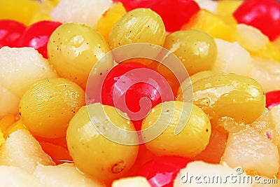 Fruit salad texture. Fruits as background pattern. Exotic fruits fruit salad with cocktail cherry sour cherry mango Stock Photo