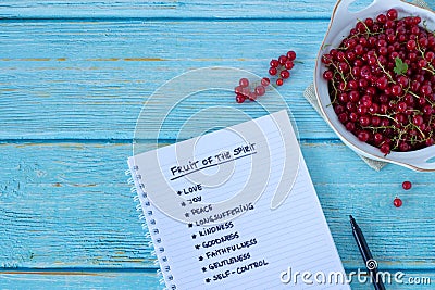 Fruit of the Spirit handwritten words with a bowl of fresh currants, top view Stock Photo