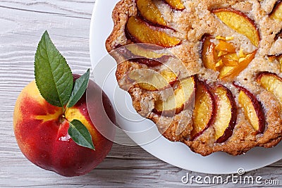 Fruit tart and fresh peach closeup top view Stock Photo