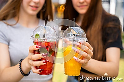 Fruit Tea Cocktails Held by Women Stock Photo