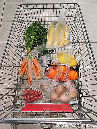 Fruit, vegetables in reusable textile fabric bags Pouch in shopping cart. Top view or flat lay. Cart with food product close up, Editorial Stock Photo
