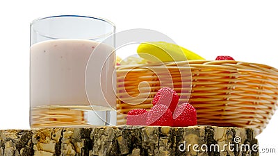 Fruit yogurt isolated on white background fruit in a basket, raspberry yogurt in a glass, close-up Stock Photo