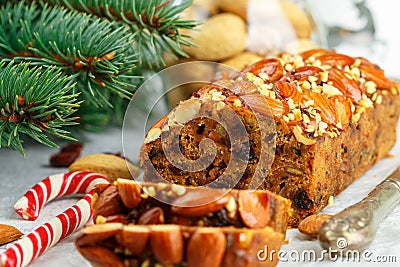 Fruitcake. Traditional Christmas cake with almonds, dried cranberries, cinnamon, cardamom Stock Photo