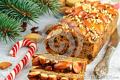 Fruitcake. Traditional Christmas cake with almonds, dried cranberries, cinnamon, cardamom Stock Photo