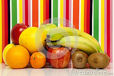 Fruits. Apple, pear, orange, grapefruit, mandarin, kiwi, banana. Multi-color background Stock Photo