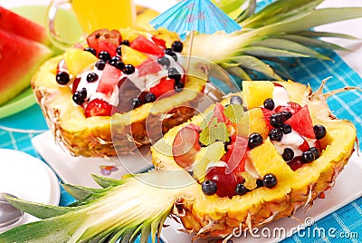 Fruits salad in pineapple Stock Photo