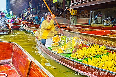 The fruits seller on sampan boat, Damnoen Saduak floating market, Thailand Editorial Stock Photo