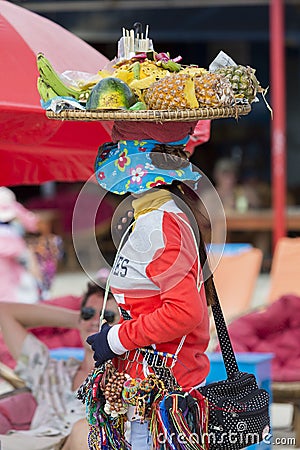Fruits seller working on the beach of Koh Rong in Cambodia Editorial Stock Photo
