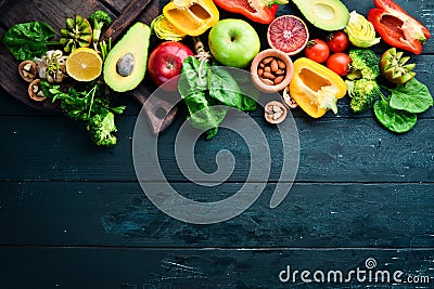 Fruits and vegetables containing fiber: Avocados, kiwi, apple, tomatoes, spinach, paprika, orange, lemon. Top view. Stock Photo