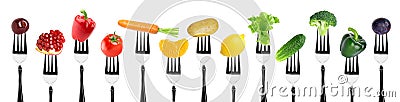 Fruits and vegetables on fork Stock Photo